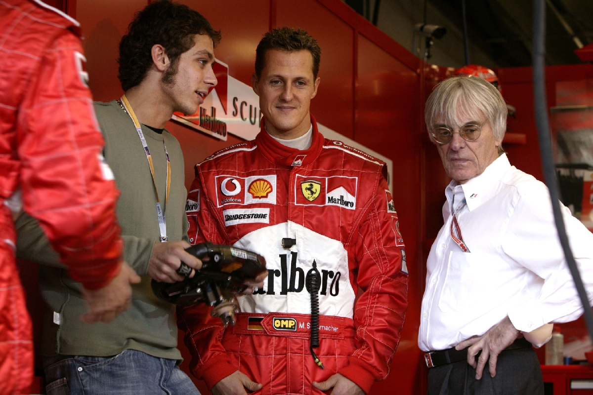 Motorbike Champion Italian Valentino Rossi visiting Ferrari garage here with Michael Schumacher and Bernie Ecclestone during the Formula One Grand Prix in Melbourne, Australia on March 7 2004. Photo by Bernard Asset/ABACAPRESS.COM