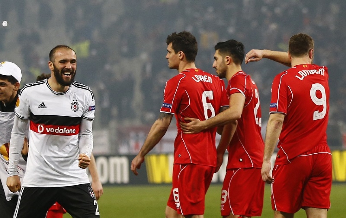 Lovren of Liverpool walks off the pitch after failing to score a penalty shot in their Europa League round of 32 second leg soccer match against Besiktas in Istanbul